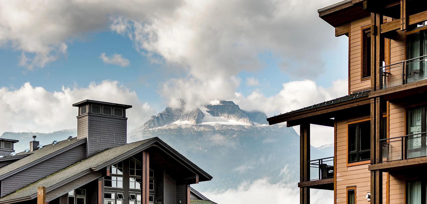 Modern mountain lodges with stunning views of the snowy peaks of Begbie