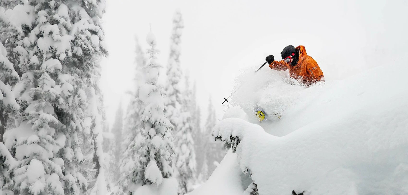 Adventure skier enjoying deep powder and epic terrain at Revelstoke Mountain Resort in British Columbia, a top destination for winter vacations in Canada